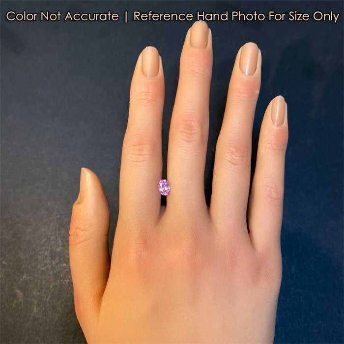 pink sapphire oval cut on hand 