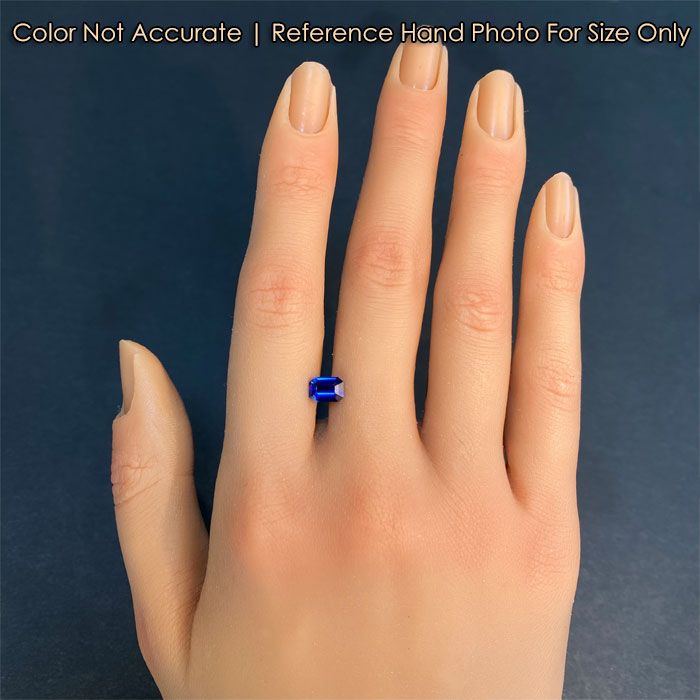 blue color sapphire gem on hand