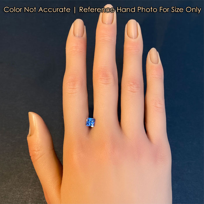 sapphire gemstone on hand blue color 