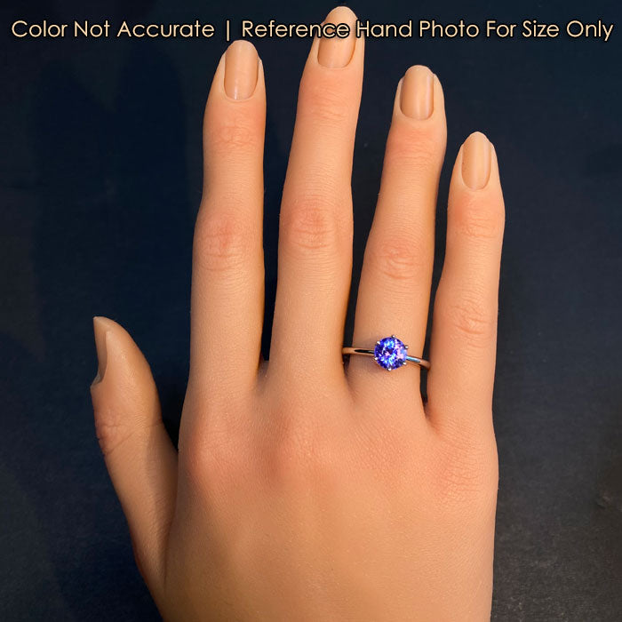 platinum and tanzanite ring on hand