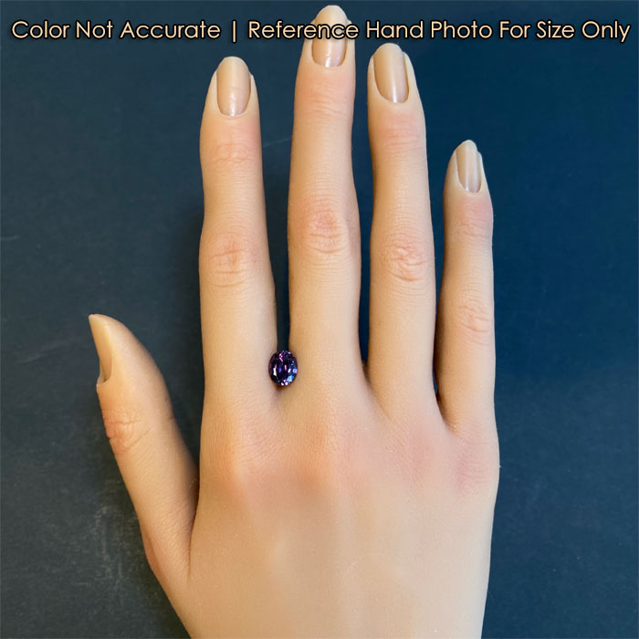 oval cut color changing garnet on hand