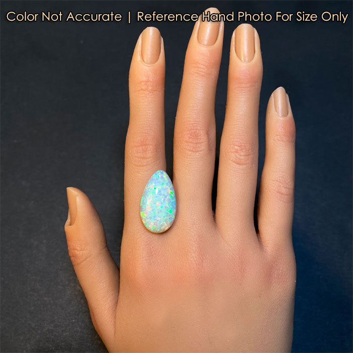 pear shape opal gem on hand
