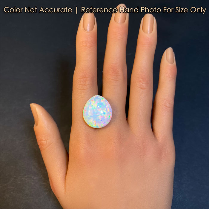 opal gemstone on hand pear shape cabochon