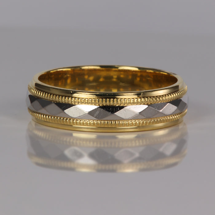 yellow gold and platinum band with diamond design