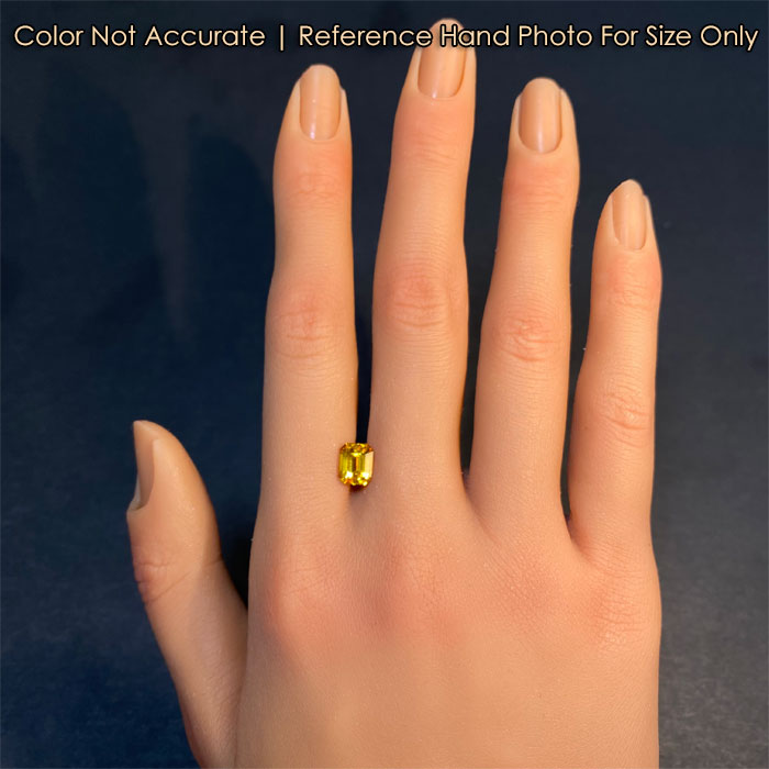 sapphire gem on hand yellow color