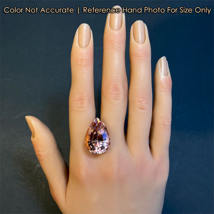 pear shape brilliant cut morganite gemstone on hand