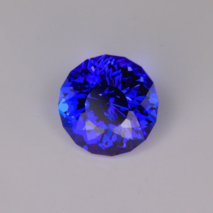 extremely brilliant tanzanite gemstone red flash