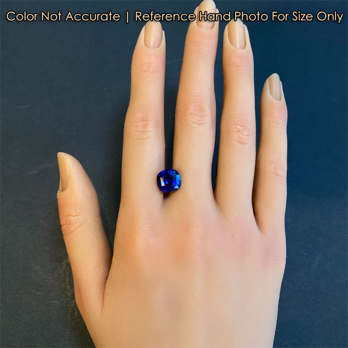 blue square cushion sapphire gem on hand