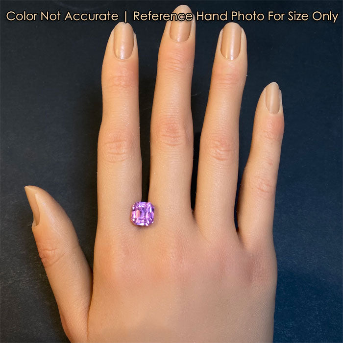 pink kunzite gem on hand