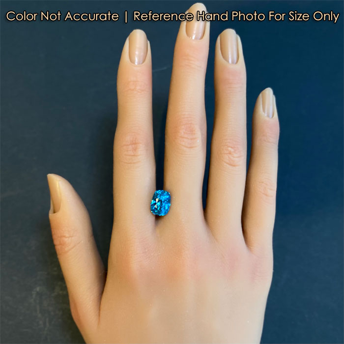 blue zircon gemstone very brilliant on hand