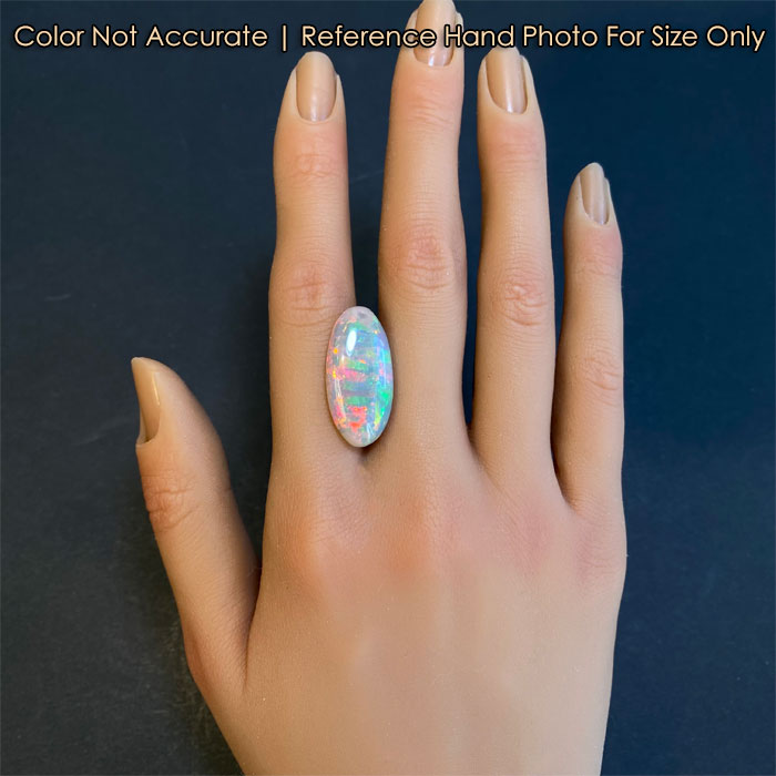 opal gem on hand oval cut semi black