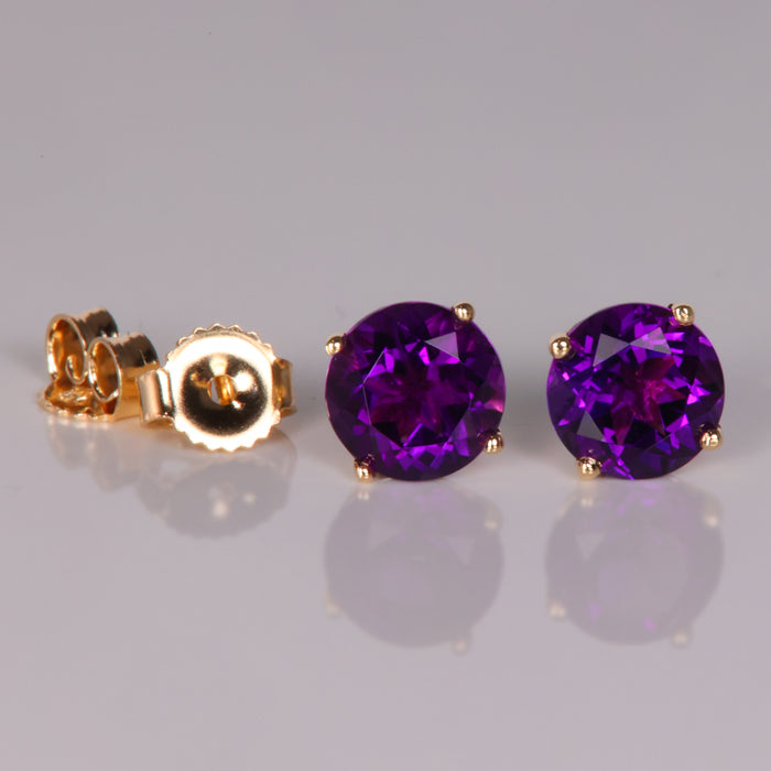 purple color round brilliant amethyst gemstone earrings in yellow gold