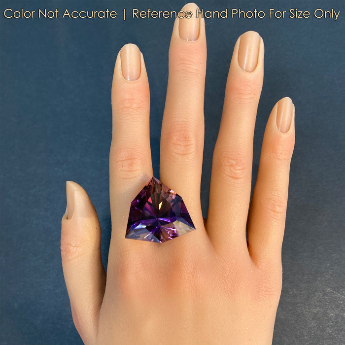 ametrine gemstone trilliant cut on hand