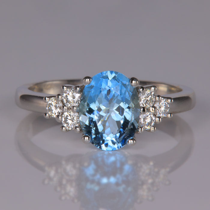 white gold ring with aquamarine gemstone and diamonds