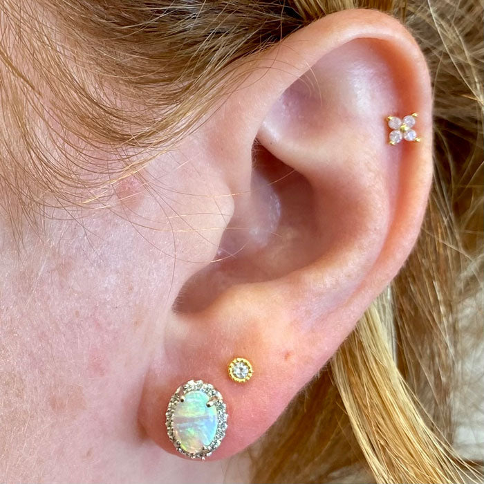 opal gemstone stud earrings on ear 