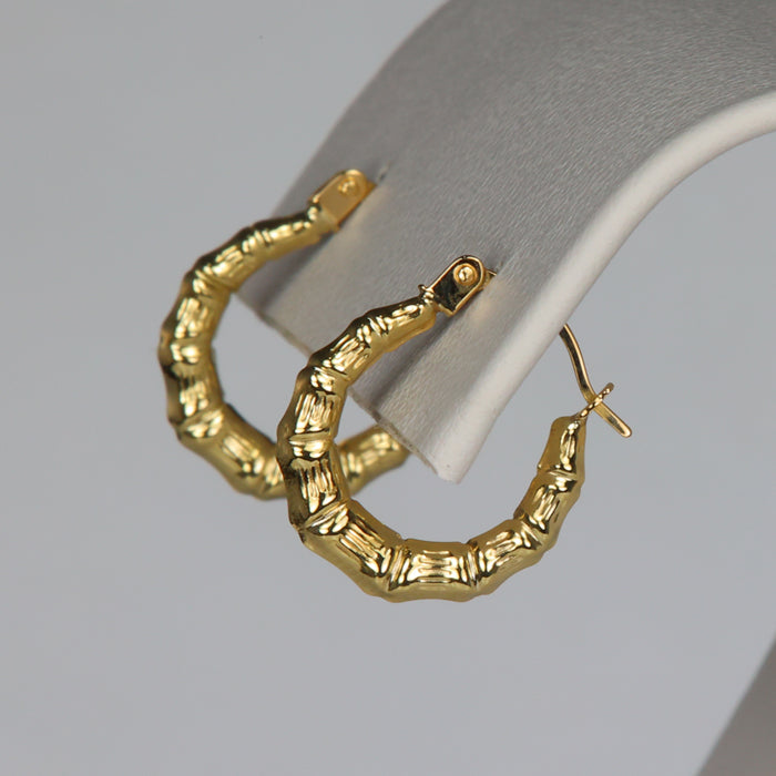 bamboo style design in yellow gold earrings hoops 