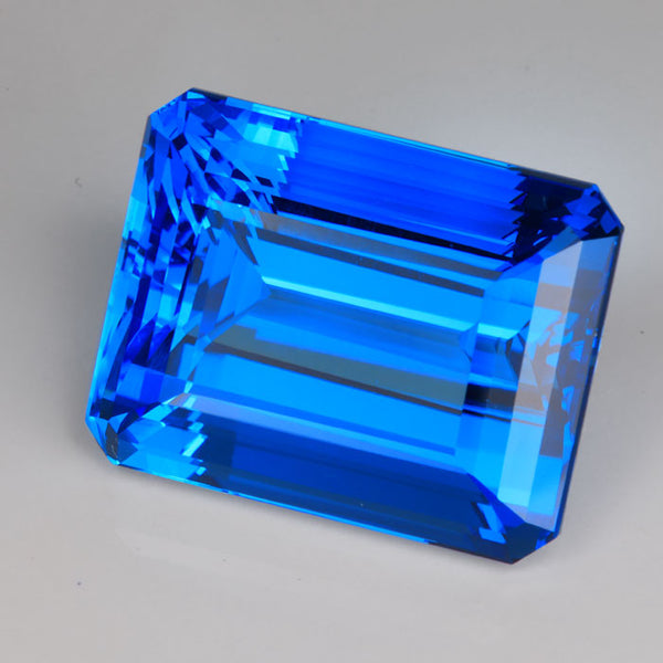 HIDDEN GEM Big Super Blue Topaz Emerald Cut 98.88ct