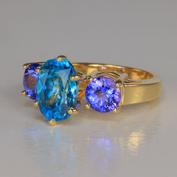 yellow gold ring with blue zircon and tanzanite
