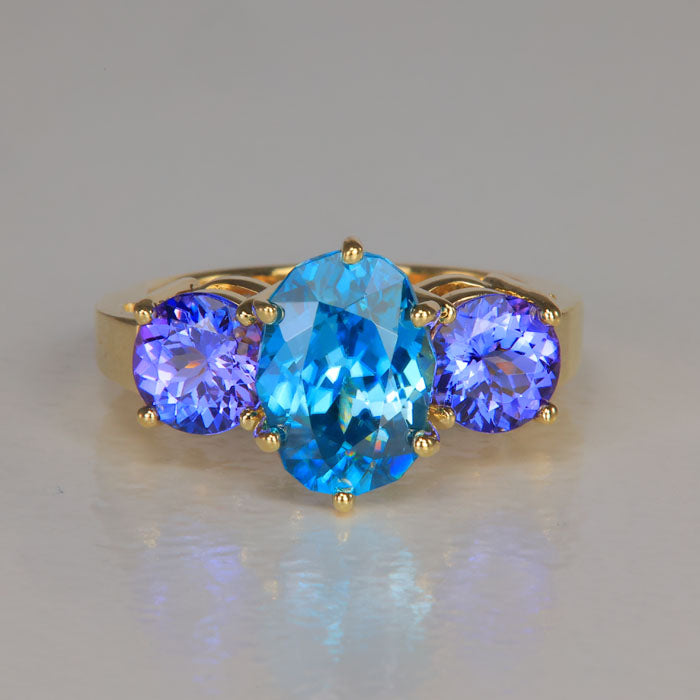 blue zircon and tanzanite rare gemstone ring in yellow gold