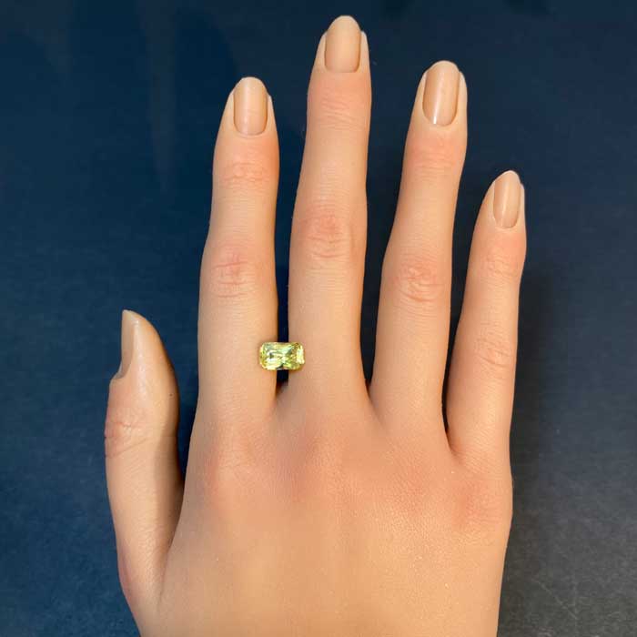 yellow sapphire gemstone on hand 