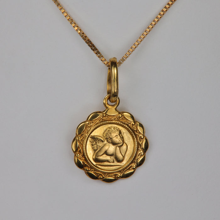 yellow gold pendant with cherub design