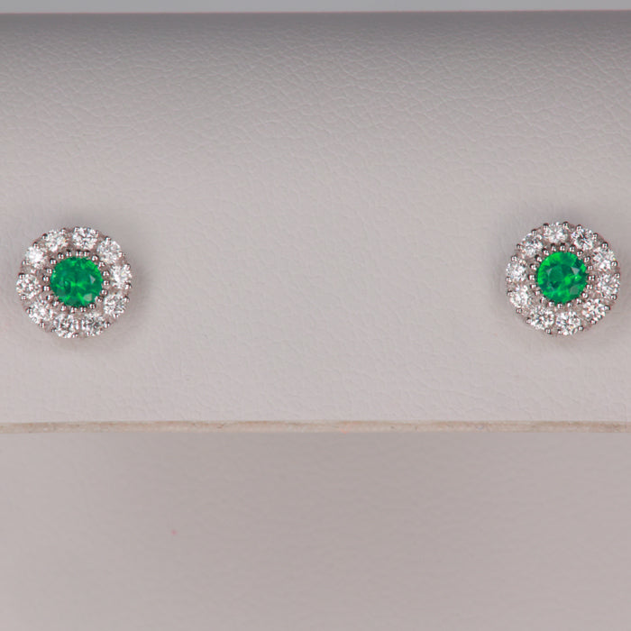 white gold emerald and diamond halo stud earrings