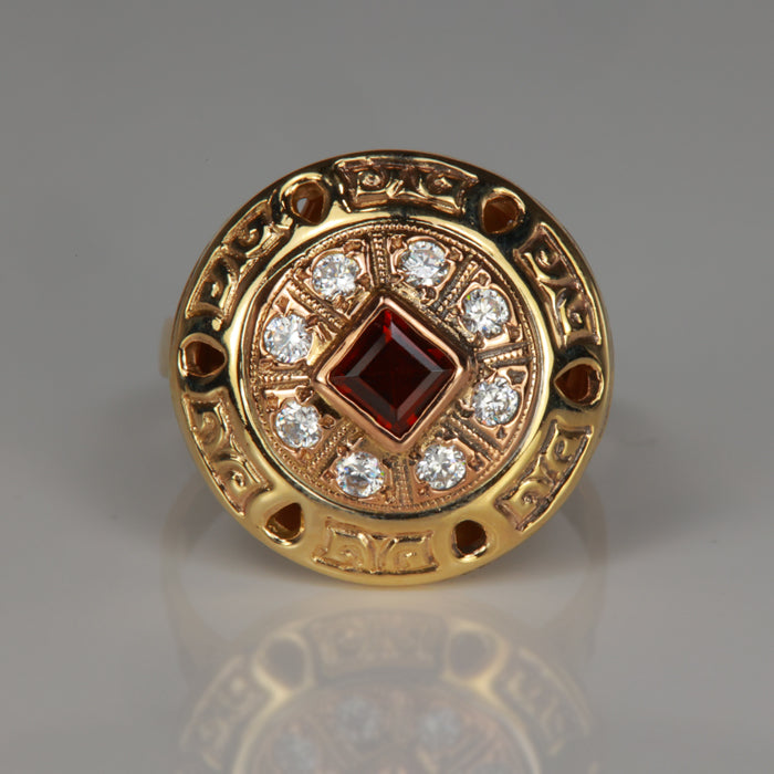 yellow gold garnet ring with cubic zirconia