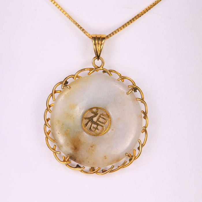 yellow gold and jade pendant for good fortune