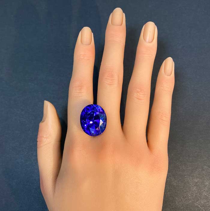 tanzanite gemstone on hand rare gem