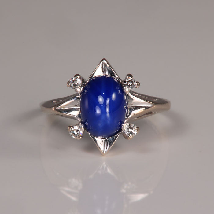 synthetic star sapphire and diamond ring in white gold