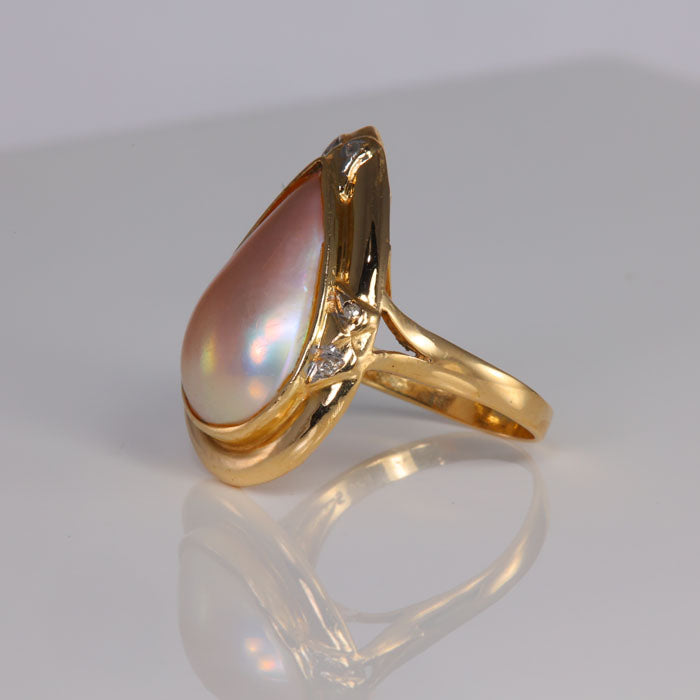 yellow gold ring with mabe pearl and diamond accents