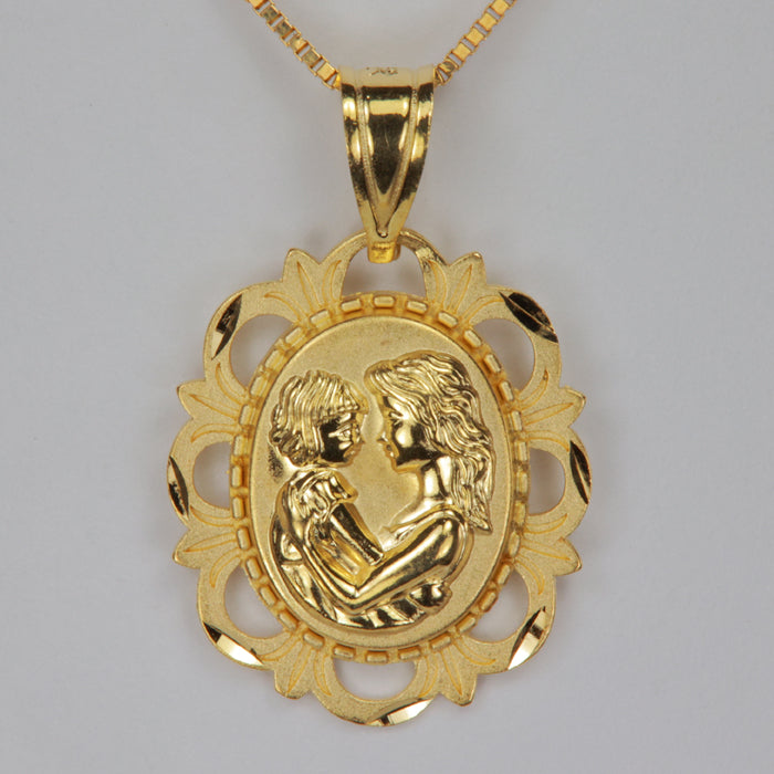 yellow gold estate pendant with a mother and child image on front