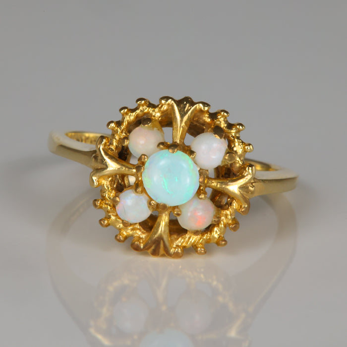 opal accent ring estate piece in yellow gold