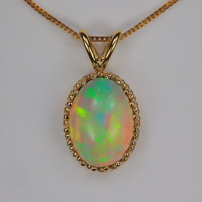 opal gemstone pendant in yellow gold