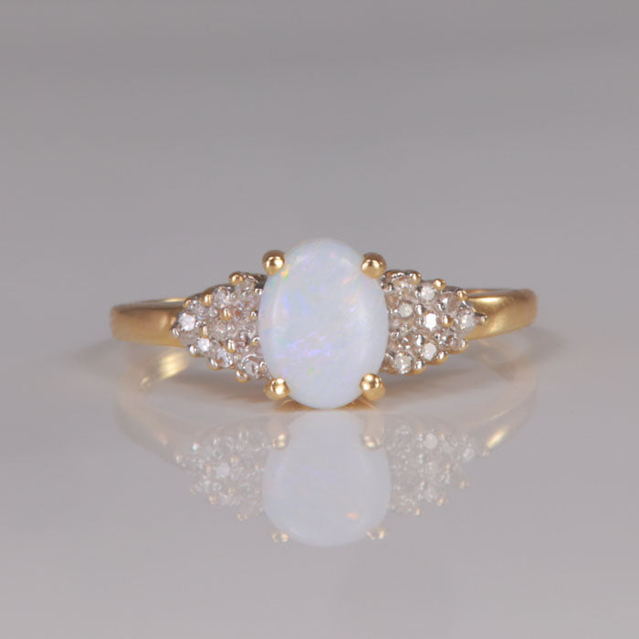 Opal and diamond accent ring
