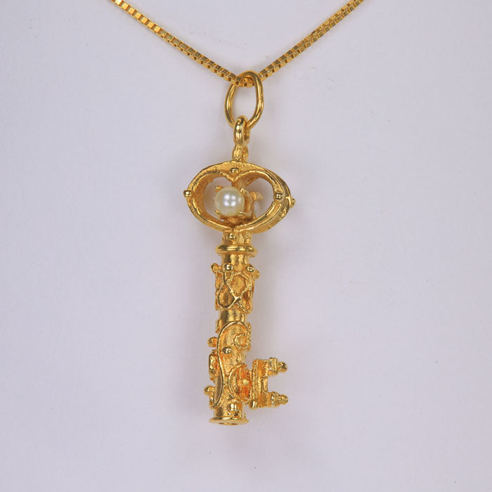 yellow gold key pendant with pearls