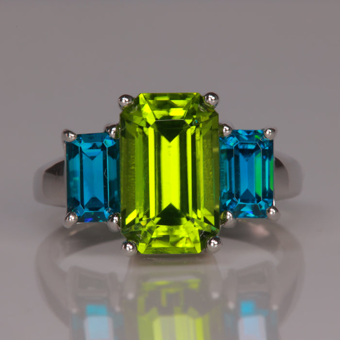 white gold peridot ring with blue zircon gems