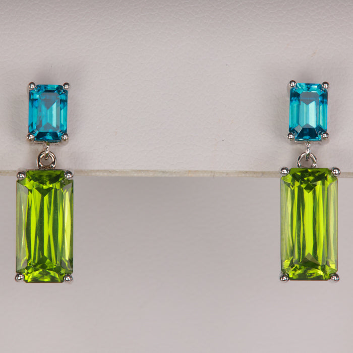 Green peridot and blue zircon gemstone earrings in white gold 