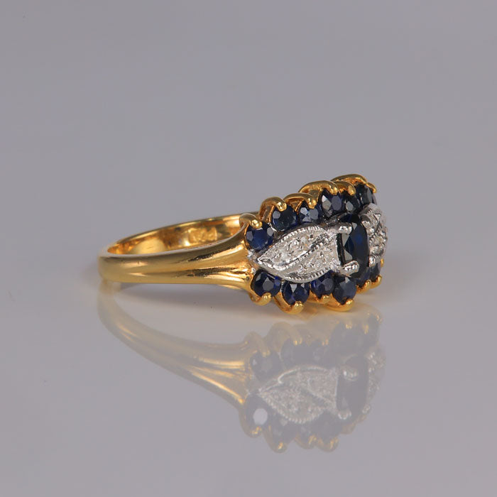 yellow gold ring with sapphires and diamond accents