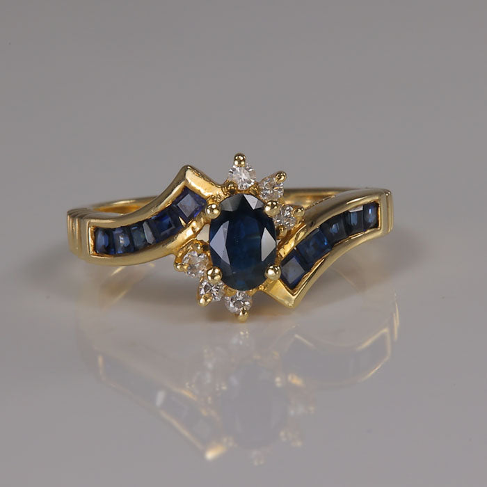 sapphire and yellow gold ring with diamonds