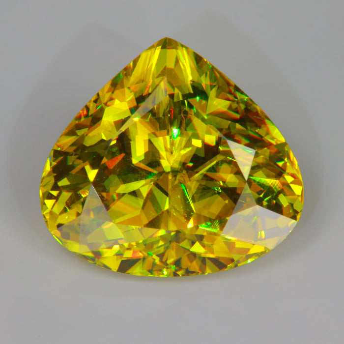 yellowish green sphene gemstone shield cut extreme dispersion