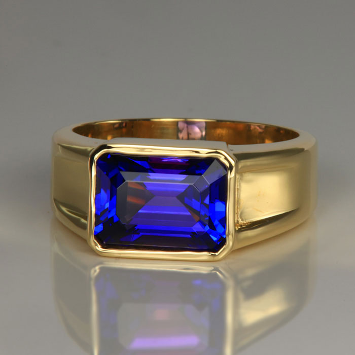 emerald cut tanzanite ring yellow gold