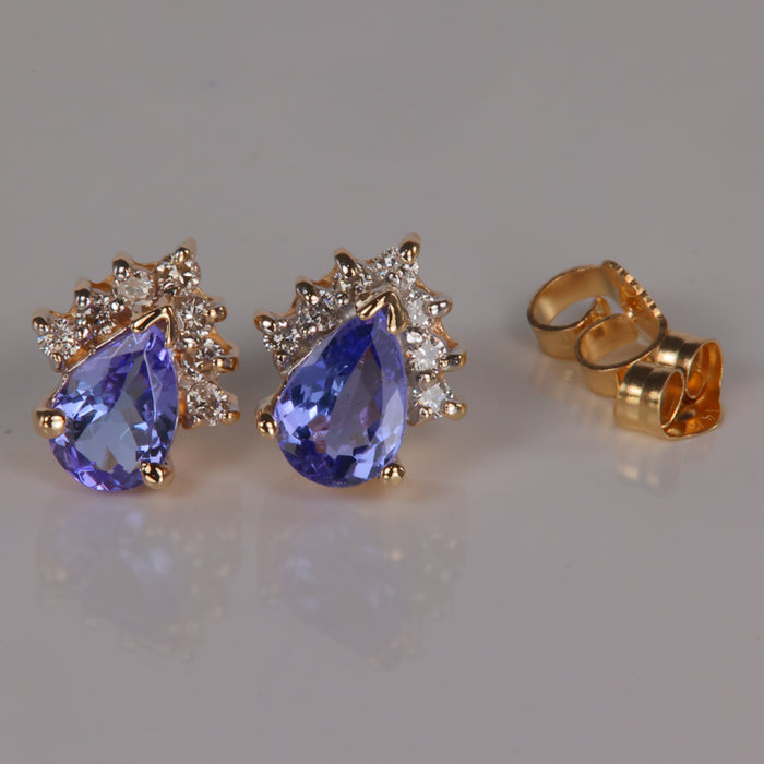 pear shape brilliant tanzanite gemstone earrings with diamond accents in yellow gold 