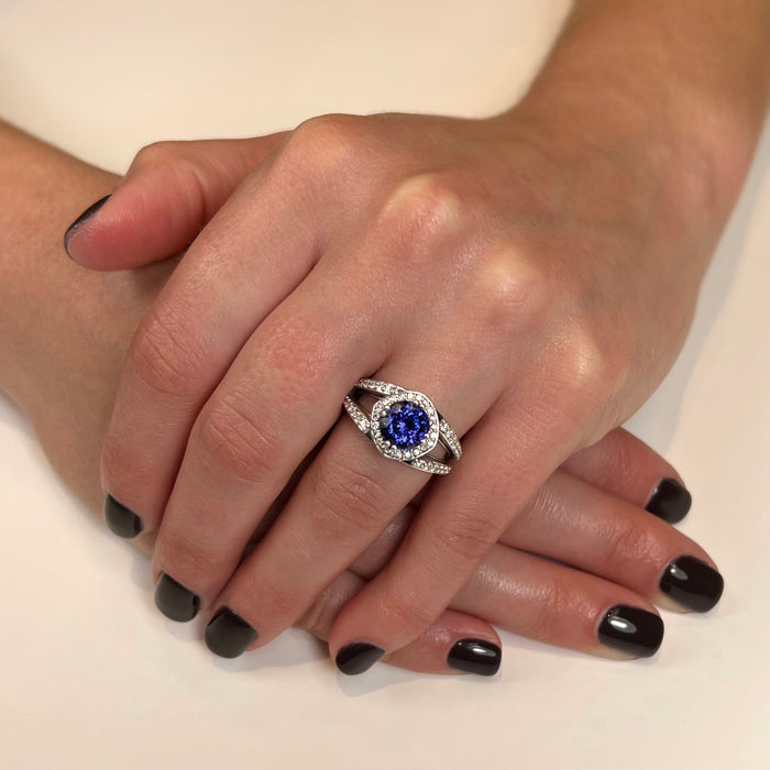 tanzanite and diamond custom ring on hand