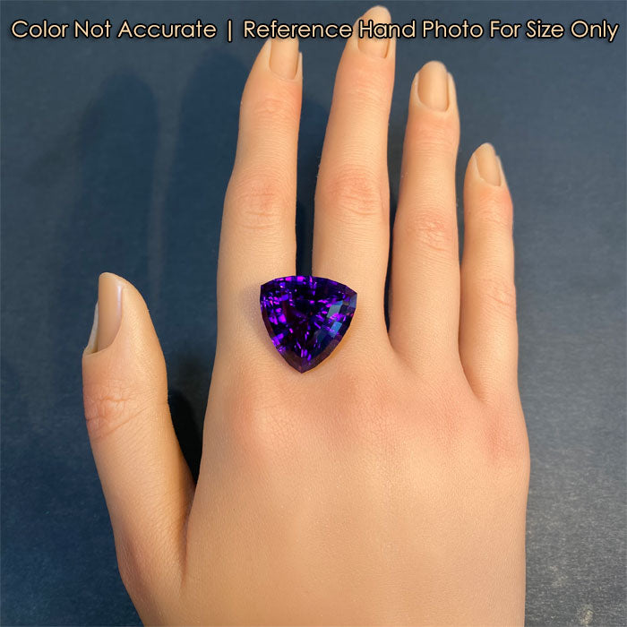 gemstone on hand beautiful amethyst trilliant cut