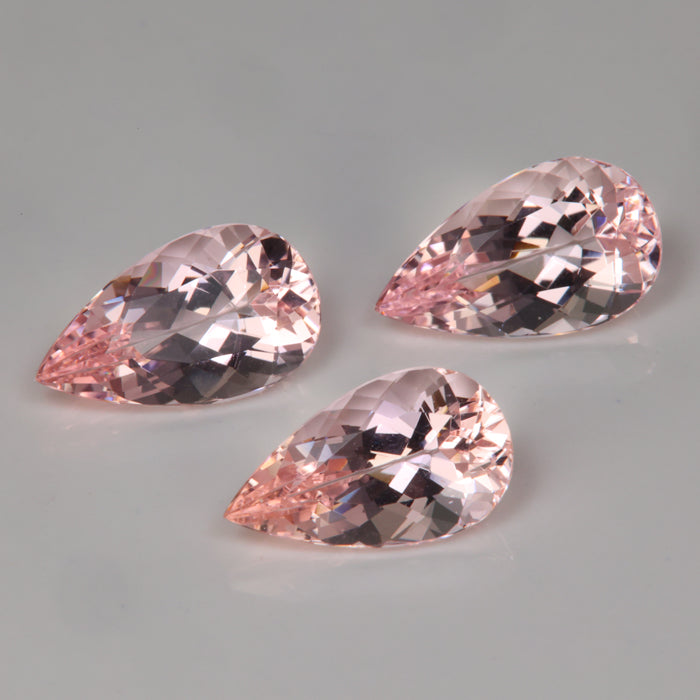 three morganite gemstones pink color