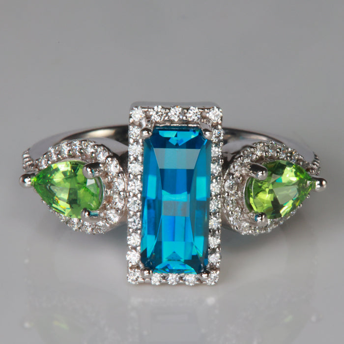 blue zircon and green garnet gemstones in white gold and diamond ring