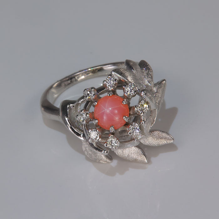 white gold ring with synthetic star sapphire and diamonds