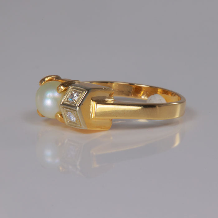 yellow gold ring with pearl and diamonds