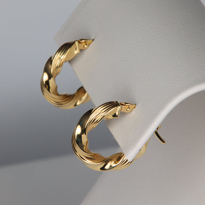 twist hoop earrings in yellow gold